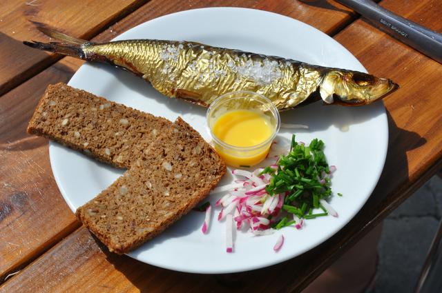 Smoked herring with rugbrød, egg yolk, onions and chives, a local delicacy of Bornholm.