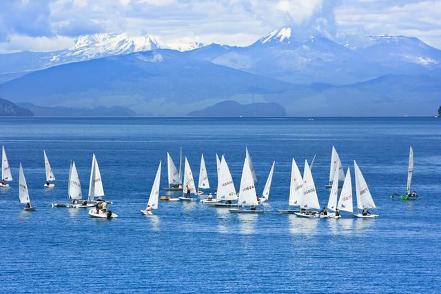 A sailing school on Lake Taupo, with volcanoes behind