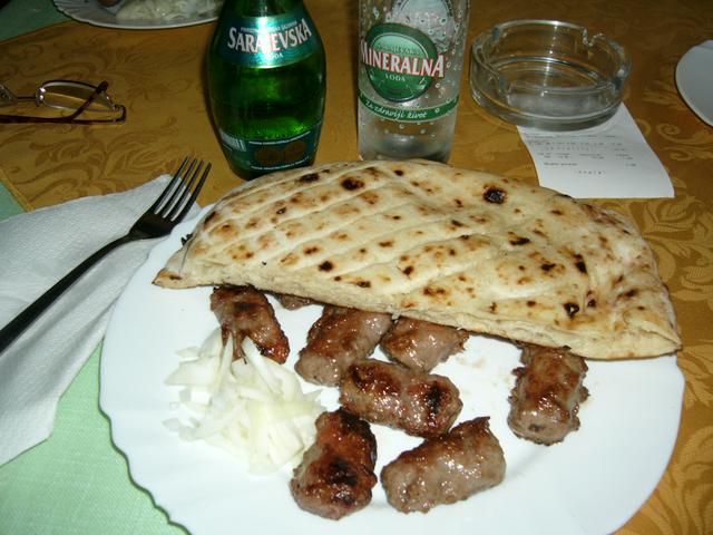 Cevapi with bread and sliced onions