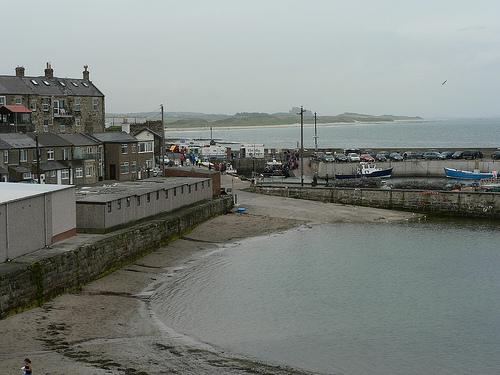 Seahouses harbour, looking north to Bamburgh castle.