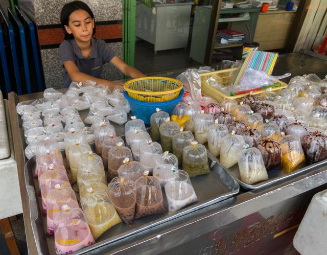 Street vendor sells drinks in plastic bags