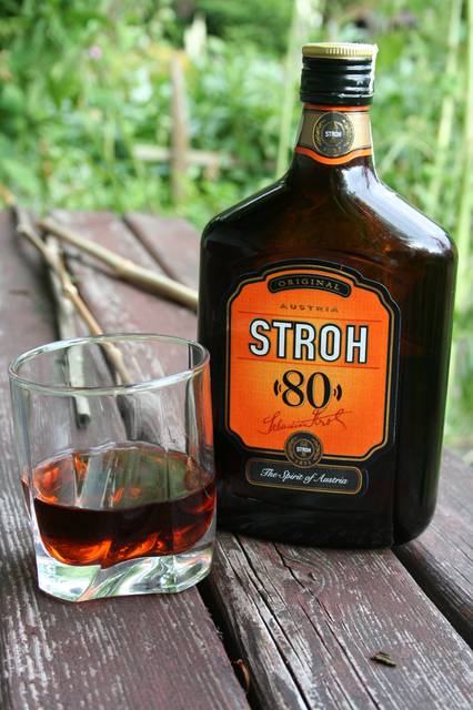 Bottle and glass of Stroh