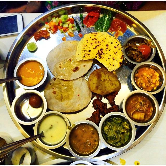 Lunch in Ahamedabad means roti, puri, vegetables, mango sweets, gulab jamun and butter milk.