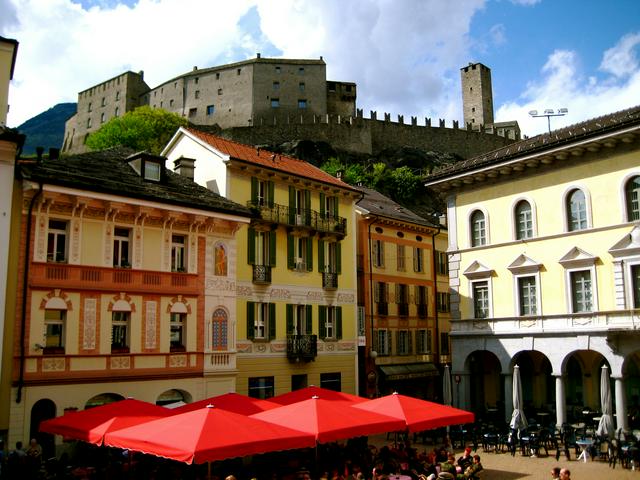 A view of a piazza and the three castles beyond