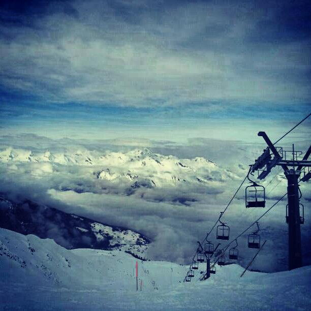 Slopes, chairlift, and clouds on a winter's day