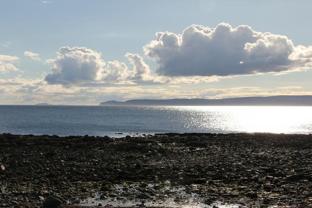 View across Drumadoon Bay from Blackwaterfoot to the Mull of Kintyre and the island of Sanda.