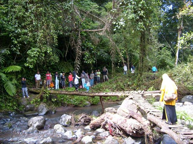 Wooden bridge across a river near Situgunung.