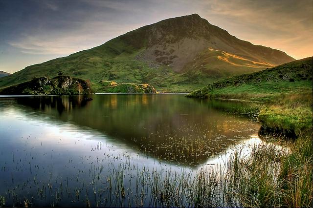 The mountain Y Garn which begins the Nantlle ridge is reflected in the calm waters of Llyn y Dywarchen