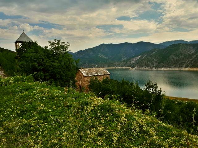 Zdunje and its main church, dedicated to the Presentation of the Virgin Mary, sit above Lake Kozjak