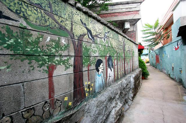 An alley in the mural village of Haengung-dong